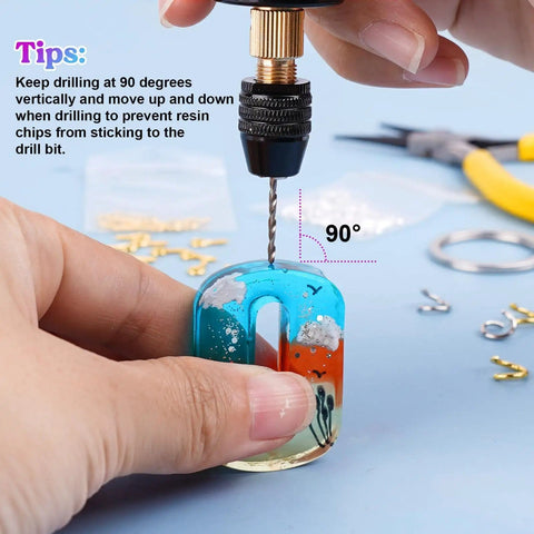 Hands using Dope Electric Jewelry Drill Kit With 74 Piece Set on resin pendant with tips display