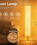 Lit 52 Inch Slim Modern Floor Lamp With RGB Color Changing Tyvek Fabric Shade in living room with wood base, glowing ambiance