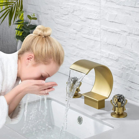 Woman using Gold Bathroom Sink Faucet With 3 Hole 2 Handle Crystal Knobs High Arc Waterfall Spout 8 Inch Widespread Vanity Basin Mixer Tap