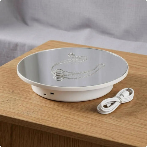 Premium Mirror White Electric Rotating Display Stand Turntable showing a 360 rotating surface with a silver necklace.