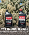 Two bottles of tubeless tire sealant for bikes on rocky surface with cactus background