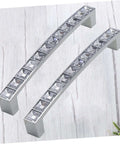 Crystal U Shaped Drawer Pull Handles In Bright Chrome With Screws, minimalist cabinet knobs on light wood surface, 2 pack