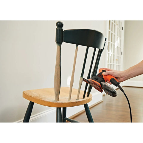 Compact 1.2 Amp Electric Mouse Detail Sander Handy For Tight Spaces with 14,000 Orbits Per Minute in use on wooden chair