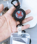 Heavy Duty Retractable Keychain With Carabiner Badge Holder And Tactical ID Reel in hand, featuring a Rotating Totem design.