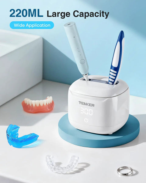 49kHz Ultrasonic Cleaner For Night Guards And Dental Gear in 220ml white pod with toothbrush, denture, and jewelry on countertop