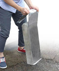 Person installing Super Tough Self Adhesive Roofing Felt Polyethylene Underlayment Roll For Asphalt Shingles And Driveway Patching.