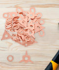Auto Body Dent Fix Kit With Puller Rings For Precise Results 50 Piece Iron Ring Set on a wooden background