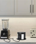 Automatic Pop Up Outlet For Countertops With Recessed Power Strip 4 AC Outlets 2 USB A 2 USB C And Wireless Charging Station on kitchen counter