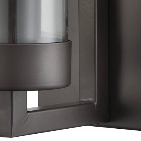 Close-up of Holbrook One Light Sconce in oil rubbed bronze with clear blown glass wall fixture detail.