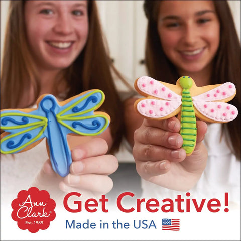 Two women holding decorated cookies shaped like dragonflies, product of Adventure Travel Cookie Cutter Set, 3-Piece Made in USA.