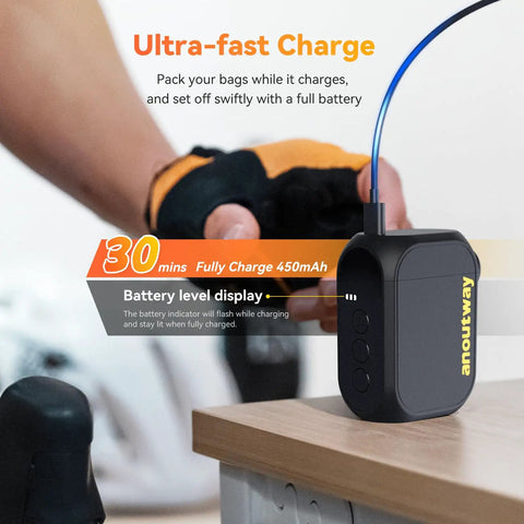 Close-up of On-The-Go Mini Bike Pump With Gauge, showing ultra-fast charge type-C battery on wooden surface