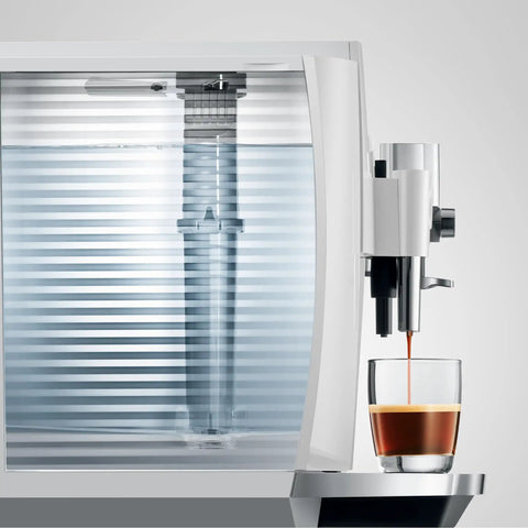 Automatic Espresso Machine With 17 Coffee Specialties, Barista Grade Milk Frothing, shown side view dispensing espresso