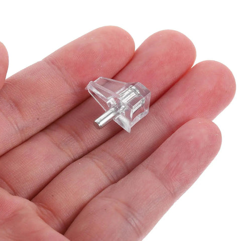 Close-up of 100 Pack Shelf Support Pegs For Cabinets And Shelves Heavy Duty Plastic DIY Brackets in hand