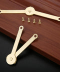 Gold Metal Lid Support Hinges Set Heavy Duty 2.68 by 0.31 Inch 2 Pack with screws shown on wooden background