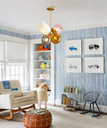 Modern Colorful Glass Pendant Lights With Gold Globe Finish in kids room, four color shades pink orange white smoke gray.