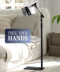 Versatile Height Adjustable Tablet Floor Stand With Dual Self Locking Gears And Straight Up Rock Solid Base Zero Shake Sixty Three Inch Reach For Tablets Phones Monitors Black adjustable stand in modern living room.