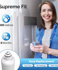 Woman holding glass of water near fridge with Replacement Refrigerator Water Filter For Bosch Ultra Clarity Pro Series 3 Pack.
