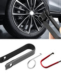 Three Piece No Sweat Wheel Hub Bolt Cover Removal Tool Set Killer Lug Nut Extractor Hooks in black and red design near vehicle tire.