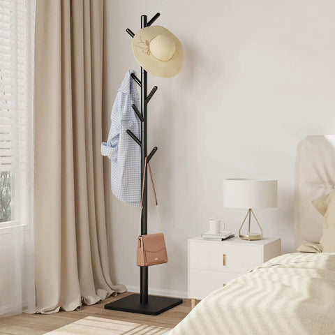 Freestanding Coat Rack With Stable Square Base 8 Hooks And 3 Adjustable Heights in bedroom, holding a hat, shirt, and bag.