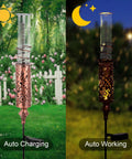 Solar Powered Rain Gauge With LED Night Light Outdoor Garden Stake Decoration 7 Inch Plastic Tube Freeze Proof Copper Metal Finish Brown Yard Gauge for Lawn and Weather Tracking in a garden, showing day and night use.