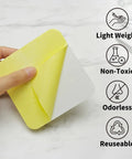 Person holding Low Profile Rug Tape For Hardwood Floors 12 Pack Reusable Non Slip Rug Pad, focusing on lightweight, non-toxic, odorless features.