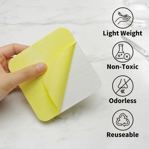 Person holding Low Profile Rug Tape For Hardwood Floors 12 Pack Reusable Non Slip Rug Pad, focusing on lightweight, non-toxic, odorless features.