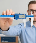 Man holding Left-Handed Digital Caliper With Large LCD Screen, Stainless Steel Body, Dual Reading In Inches And Millimeters