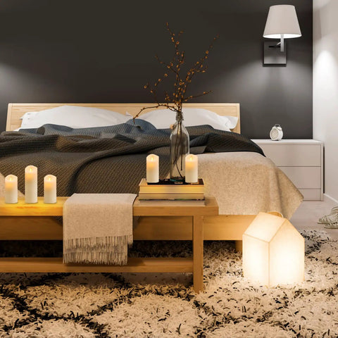 Lit 12 Pack Flameless LED Candles Battery Operated Waterproof Pillars With 2 Remote Controls on bedroom shelf