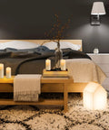 Bedroom scene with Lit 12 Pack Flameless LED Candles Battery Operated Waterproof Pillars With 2 Remote Controls arranged on a wooden bench.