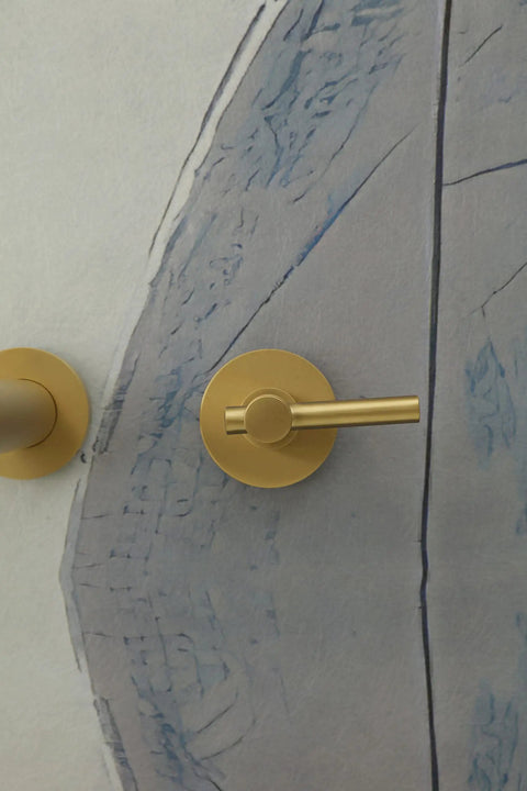 Close-up of handles from the Wall Mount Tub Filler With Two Handles Bathtub Faucet, Gold Brushed Finish.