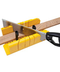 Miter Box With Saw For Clean 90 45 And 22.5 Degree Angled Cuts, yellow base, cutting a wooden piece, easy to use for DIYers.