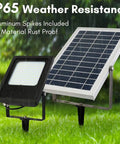 JUDYSSY Solar Floodlight Outdoor, IP65 waterproof aluminum flood lights with solar panel on grass, suitable for garden and pathway.