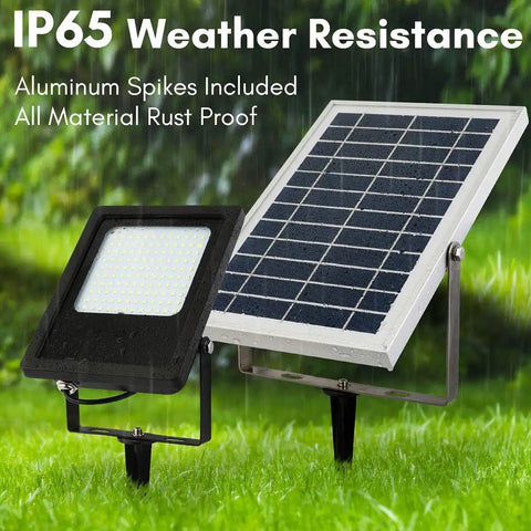 JUDYSSY Solar Floodlight Outdoor, IP65 waterproof aluminum flood lights with solar panel on grass, suitable for garden and pathway.