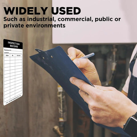 Person holding a clipboard with inspection record, using 200 Pack Dot Inspection Stickers And Heavy Duty Adhesive Labels 6 By 3 Inches For Equipment Maintenance.