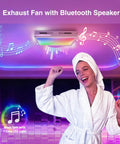 Woman enjoying music under exhaust fan with Bluetooth and 7-color LED light.