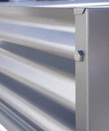 Close-up of galvanized steel construction of a raised garden bed with visible bolts for sturdy assembly, providing better drainage.