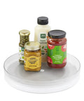 Hassle Free 360 Spin Fridge Turntable with jars of sauces on a non-slip base, showing kitchen organization capabilities.
