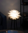 Lit Dope Hanging Puzzle Lamp Kit Lotus Flower Pendant Light With DIY Shade 19.7 Inch placed on table in a cozy room setting