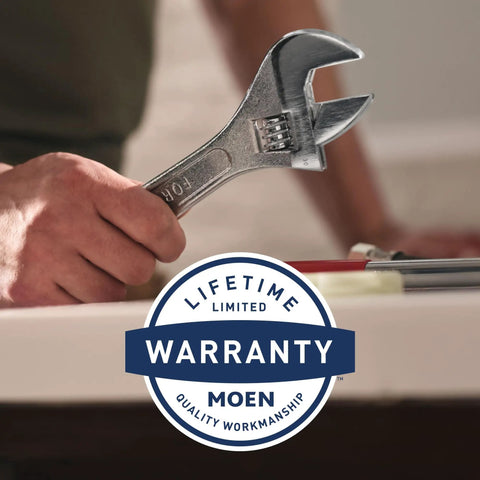 Person holding a wrench next to a sink, Moen lifetime limited warranty badge visible.