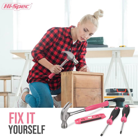 Woman using tools from the Pink 38-Piece Essential Tool Box Set With Storage Case For DIY Dorms And Home Quick Fixes Ergonomic Non-Slip Steel Hand Tools Compact Handy Kit For Everyday Repairs And Weekend Projects