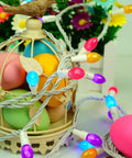Dope Easter String Lights 50 LEDs, 17 Foot Multi Color Pastel Glow On White Wire wrapped around a decorative birdcage with eggs