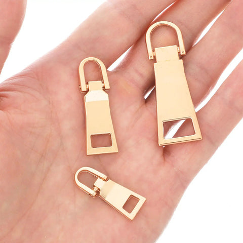Six Piece Gold Zipper Pull Replacement Set In Gold Zinc Alloy For Luggage Backpacks Jackets Suitcases And Coats With Three Sizes