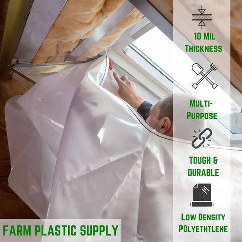 Construction worker using 10 mil thick clear plastic sheeting roll as a barrier on a job site, showing durability and multi-purpose use.