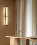 JGSYD Led Modern Wall Lamp Indoor with Remote Control Wall Light 2700K-6500K Dimmable Wall Sconce Long Strip Decorative Wall Lighting Stainless Steel for Bedroom Hallway Living Room,Black-70Cm on a wood panel wall.