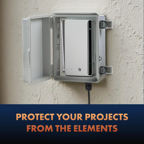 Outdoor Weatherproof Junction Box With Hinged Cover In Lightweight Polycarbonate NHWE M, NEMA 4X Rated Electrical Cabinet For Outdoor Wiring, Plugs, And Cables, Includes Cable Glands, Mounting Plate, UV And Rain Shield. Open wall-mounted box with router inside