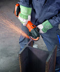 Person using a Compact 18V Brushless Cordless Angle Grinder With 125 MM Disc and Rock Solid Dust Resistant Design for cutting metal.