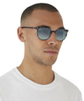 Slim Square Unisex Sunglasses With Black Frame And Green Lenses, 50mm, shown on person for narrow fit demonstration