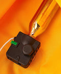 Close-up of Two Pack CO2 Cartridges 24G And 33G With Half Inch Thread for inflatable life jackets on orange fabric