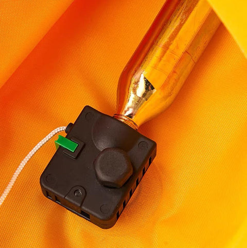 Close-up of Two Pack CO2 Cartridges 24G And 33G With Half Inch Thread for inflatable life jackets on orange fabric