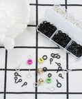 Must Have 300Pcs Small Screw Eye Pins For Jewelry Making And DIY Crafts in silver and black with bead and charm accessories on grid background